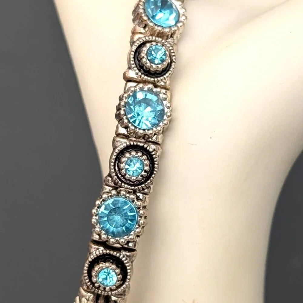 Silver stretch bracelet with blue faceted glass beads